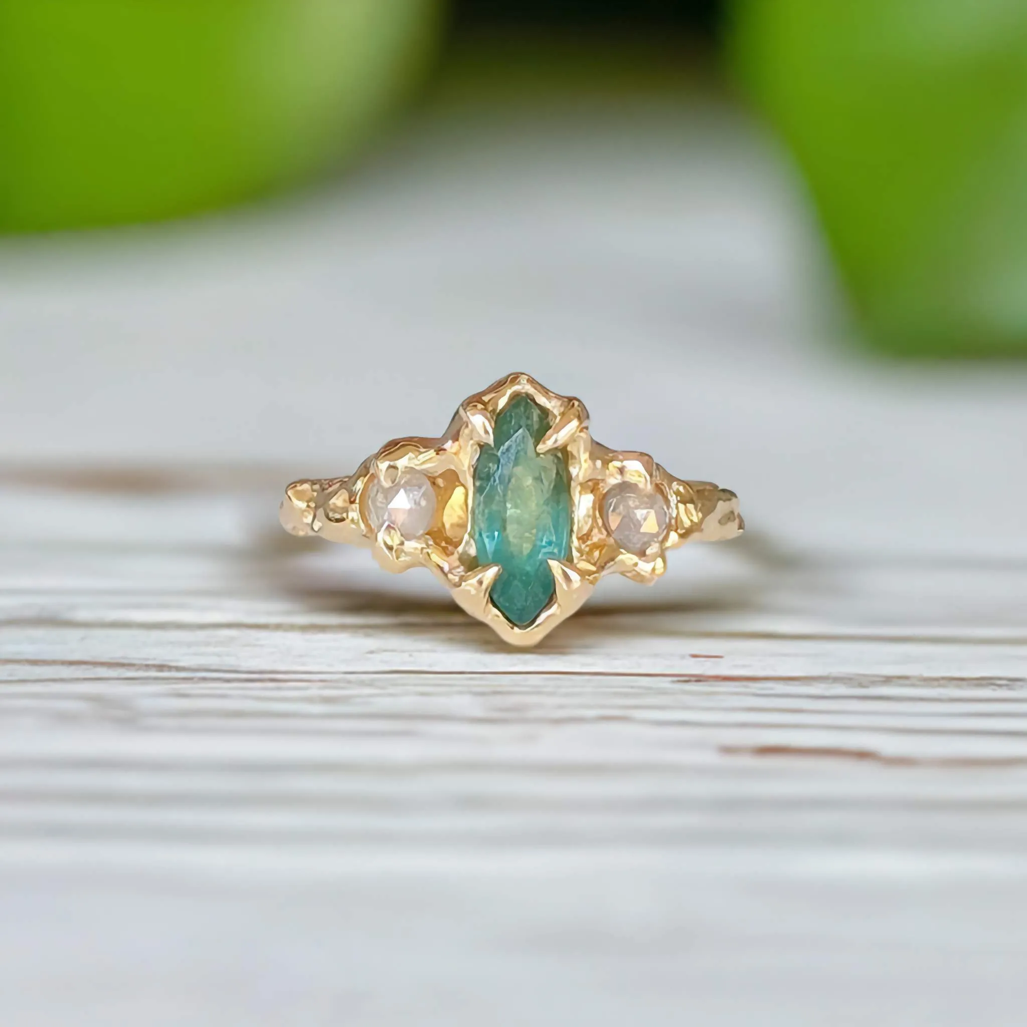 Emerald and diamond engagement ring