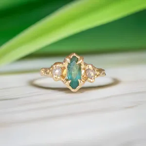 Emerald and diamond engagement ring