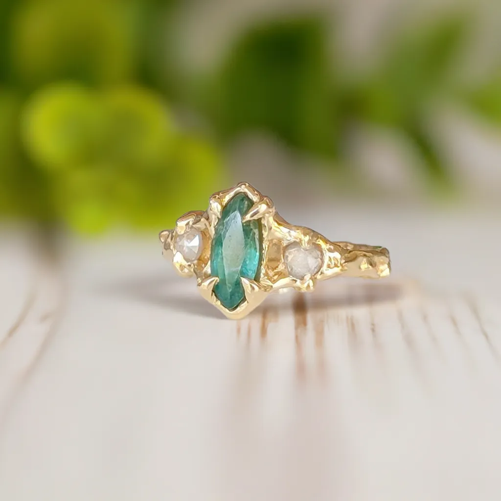 Emerald and diamond engagement ring