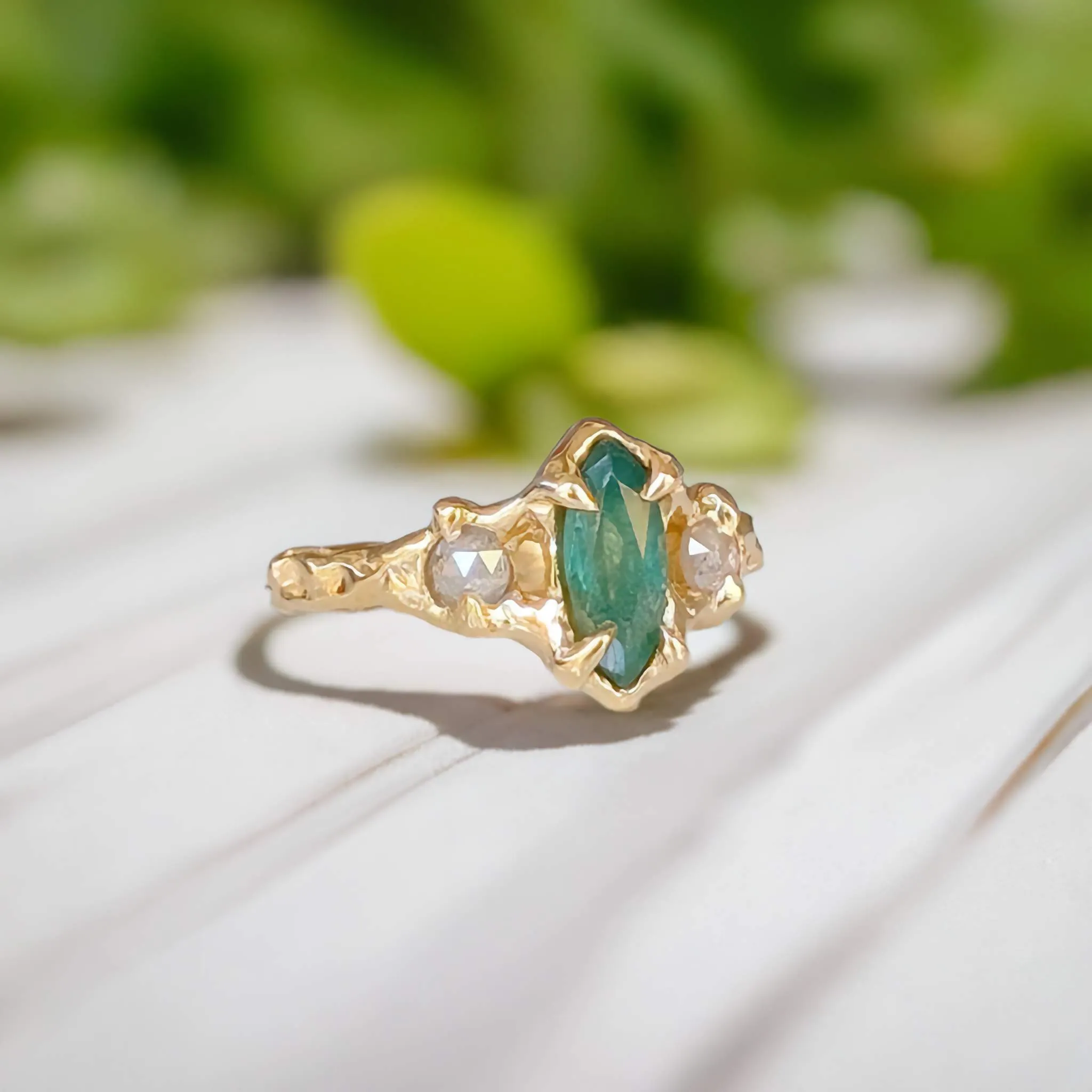 Emerald and diamond engagement ring