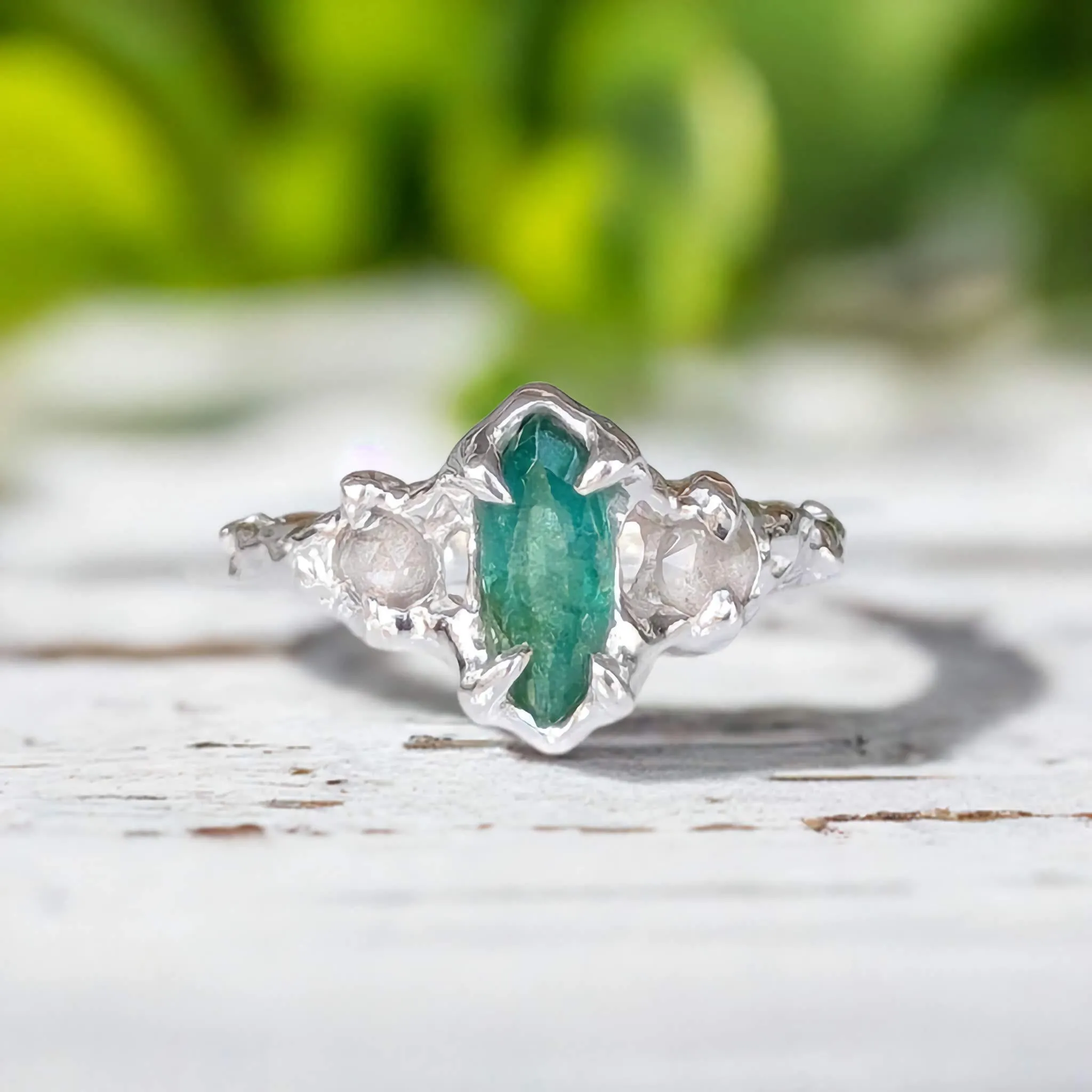 Emerald and diamond engagement ring