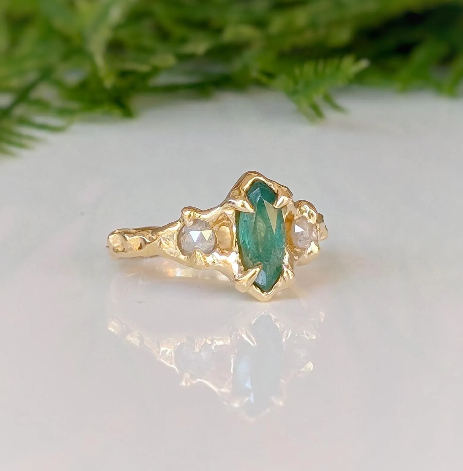 Emerald and diamond engagement ring